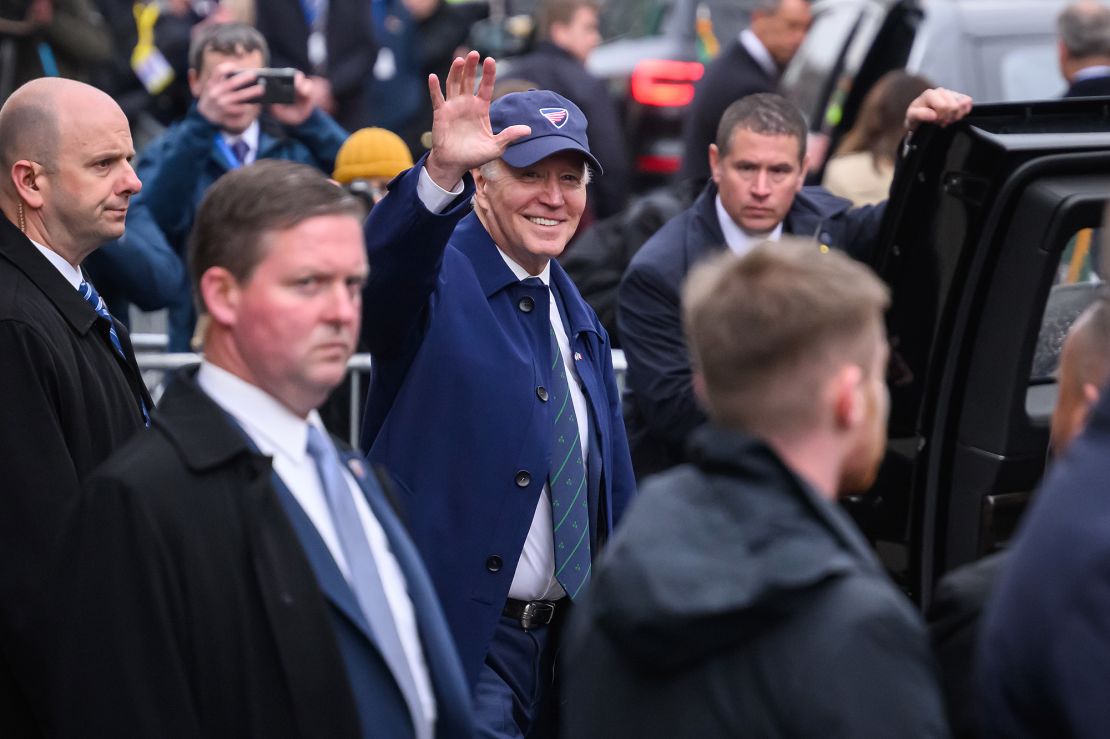 President Joe Biden waves to members of the public who have gathered for his arrival on April 12, 2023 in Dundalk, Ireland. 