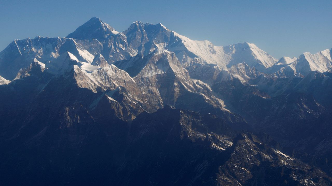 FILE PHOTO: FILE PHOTO: Mount Everest, the world highest peak, and other peaks of the Himalayan range are seen through an aircraft window during a mountain flight from Kathmandu, Nepal January 15, 2020. REUTERS/Monika Deupala//File Photo/File Photo