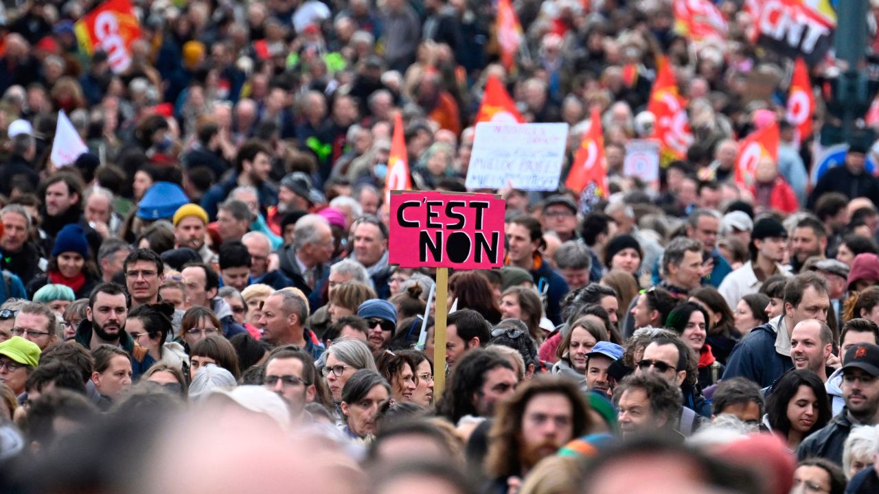 TOPSHOT - A placard which reads "it's No" is pictured as protesters march during a demonstration on the 12th day of action after the government pushed a pensions reform through parliament without a vote, using the article 49.3 of the constitution, in Rennes, northwestern France on April 13, 2023. - France faced nationwide protests and strikes on April 13, 2023, to denounce the French government's pension reform on the eve of a ruling from France's Constitutional Council on the reform. (Photo by Damien MEYER / AFP) (Photo by DAMIEN MEYER/AFP via Getty Images)