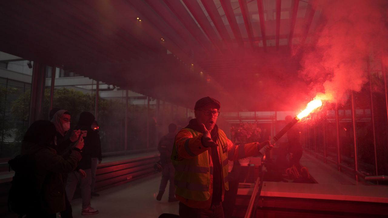 Striking railway workers invade French luxury group LVMH's headquarters on Thursday in Paris. 