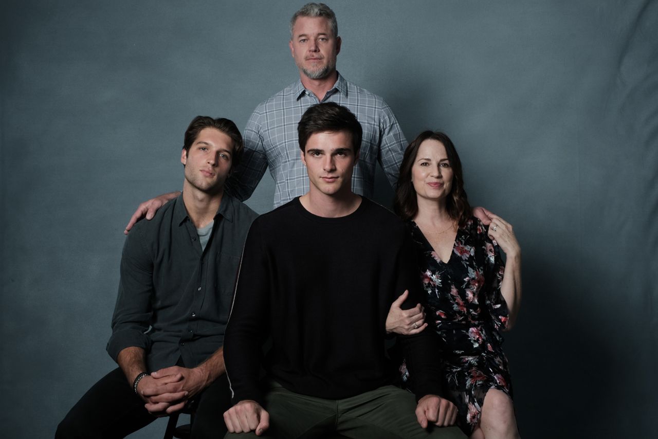 Cal (back row) and Nate (front center) pose for a family photo.