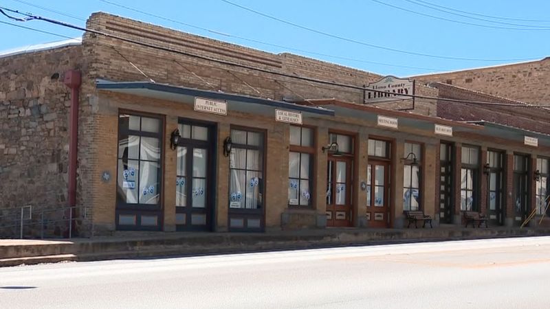NextImg:Texas county commission votes to keep library in operation after threat of closure over banned books | CNN