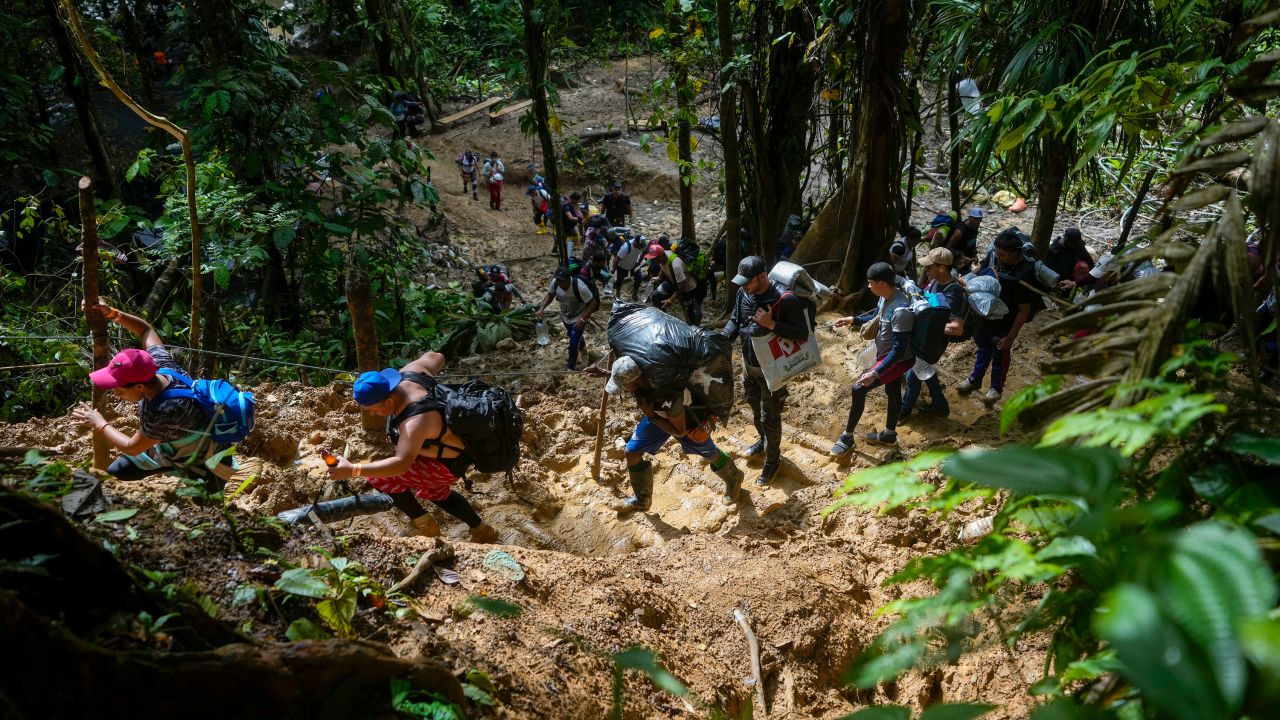 Migrants walk across the Darien Gap from Colombia into Panama hoping to reach the US. on Oct. 15, 2022.