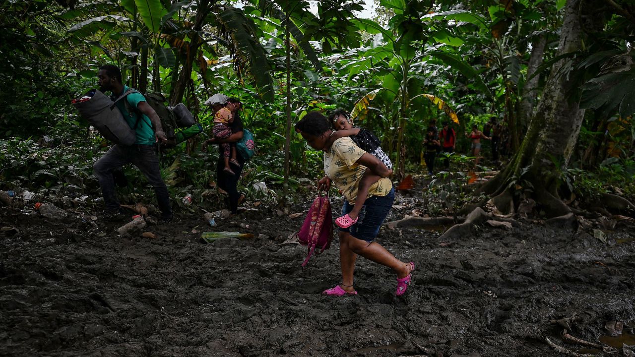 Venezuelan migrants arrive at Canaan Membrillo village, the first border control of the Darien Province in Panama, on October 13, 2022.