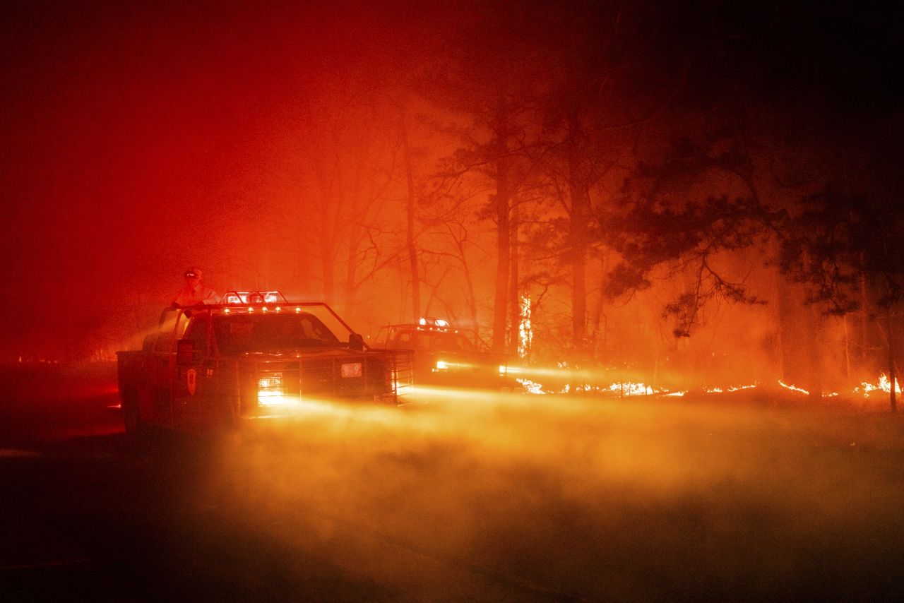 Firefighters battle a major wildfire in Ocean County, New Jersey, on Wednesday, April 12. The fire had burned nearly 4,000 acres by Wednesday evening.