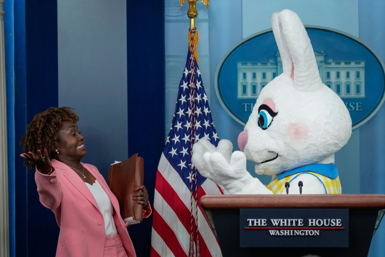White House press secretary Karine Jean-Pierre reacts as a costumed Easter Bunny attends the daily press briefing on Monday, April 10.
