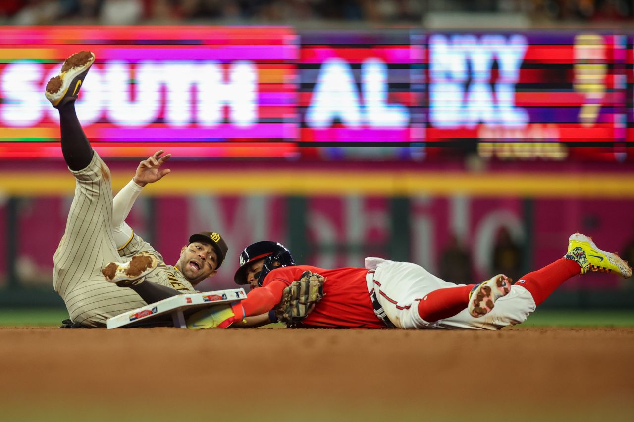 Atlanta Braves outfielder Ronald Acuña Jr., right, steals a base as San Diego's Xander Bogaerts tries to tag him out during a Major League Baseball game on Friday, April 7.