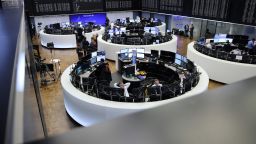 Traders work at the stock exchange in Frankfurt am Main, western Germany, on March 20, 2023. - Shares in European banks sank despite a buyout of Credit Suisse by Swiss lender UBS aimed at preventing a global banking crisis.