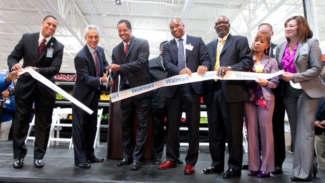 Chicago Mayor Rahm Emanuel cut the ribbon at the grand opening of a new Walmart in 2013. City leaders saw Walmart as a a way to fill access gaps. 