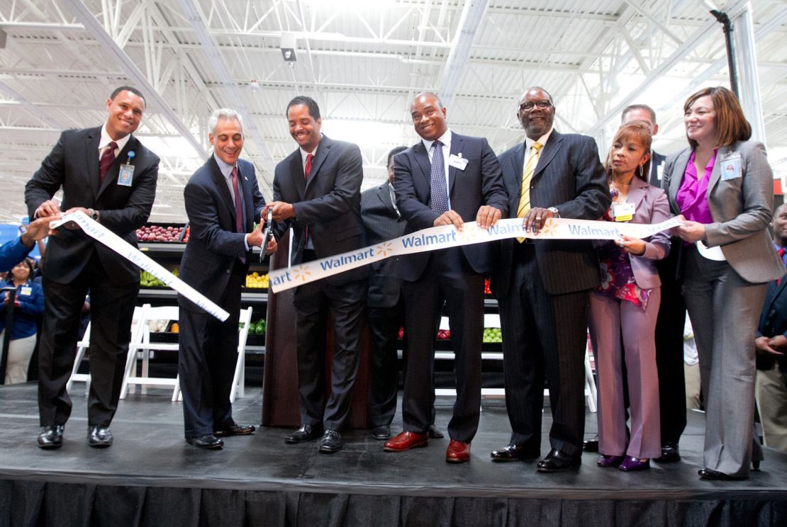 Chicago Mayor Rahm Emanuel cut the ribbon at the grand opening of a new Walmart in 2013. City leaders saw Walmart as a a way to fill access gaps. 