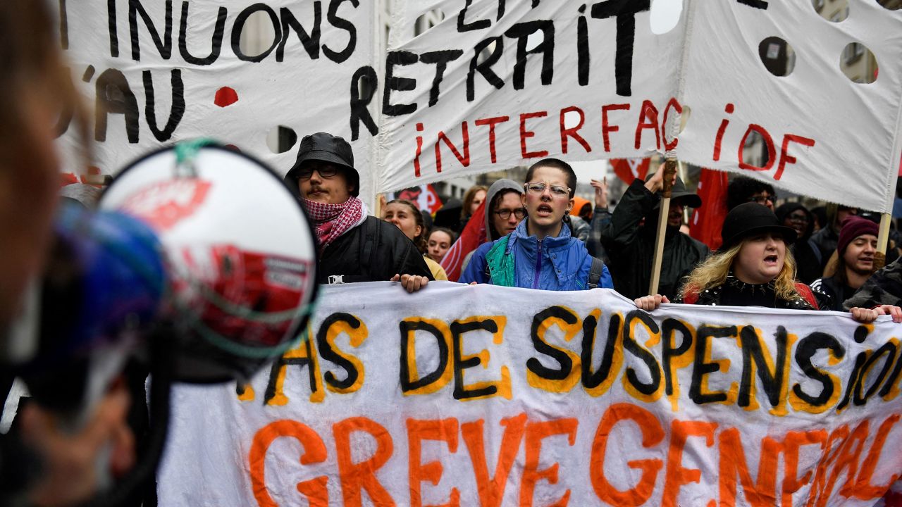 Students and young protesters gather in front of Gare Saint Lazare train station in Paris on April 14, 2023. 