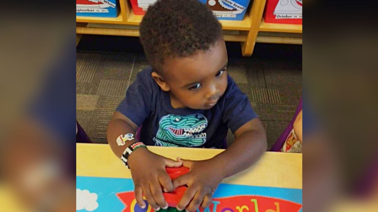 Liam wearing a bracelet showing the colors of the flag of Kenya, where his parents are from.