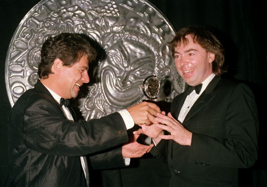 Lloyd Webber, right, and theatrical producer Cameron Mackintosh hold the Tony Award that "Phantom" won for best musical in 1988.