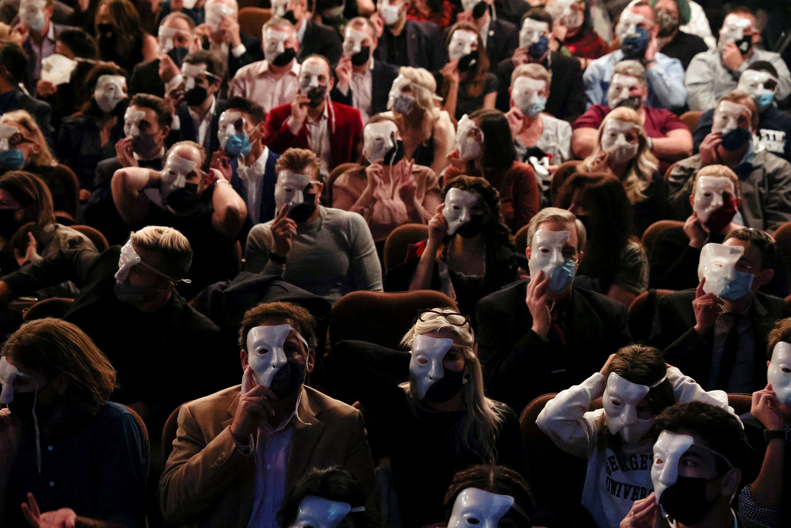 Audience members wear phantom masks during a 2021 performance.