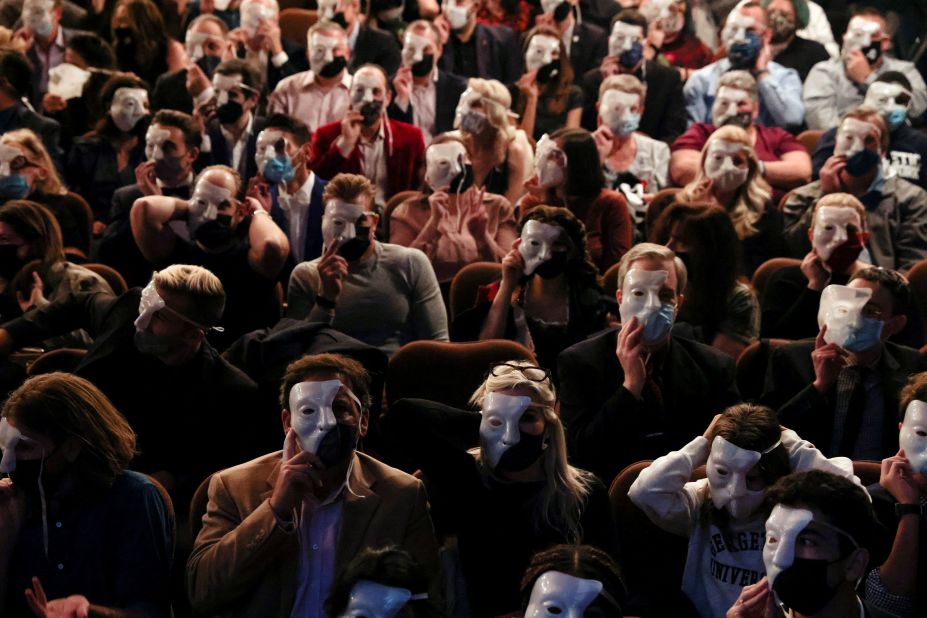 Audience members wear phantom masks during a 2021 performance. 