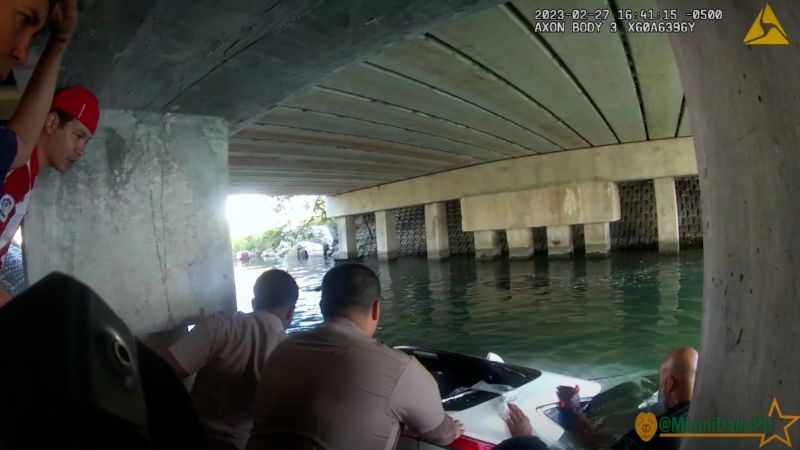 NextImg:Video: Bodycam shows cops performing CPR after rescuing boy from sinking car | CNN
