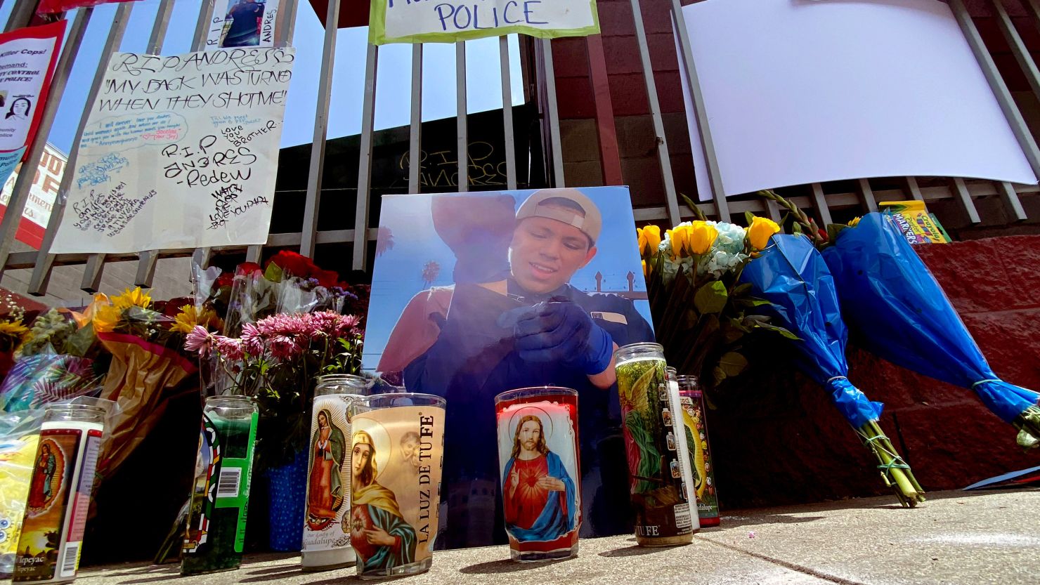 Pictures, candles and notes sit at a makeshift memorial after Andrés Guardado was shot and killed by a Los Angeles County sheriff's deputy in June 2020.  