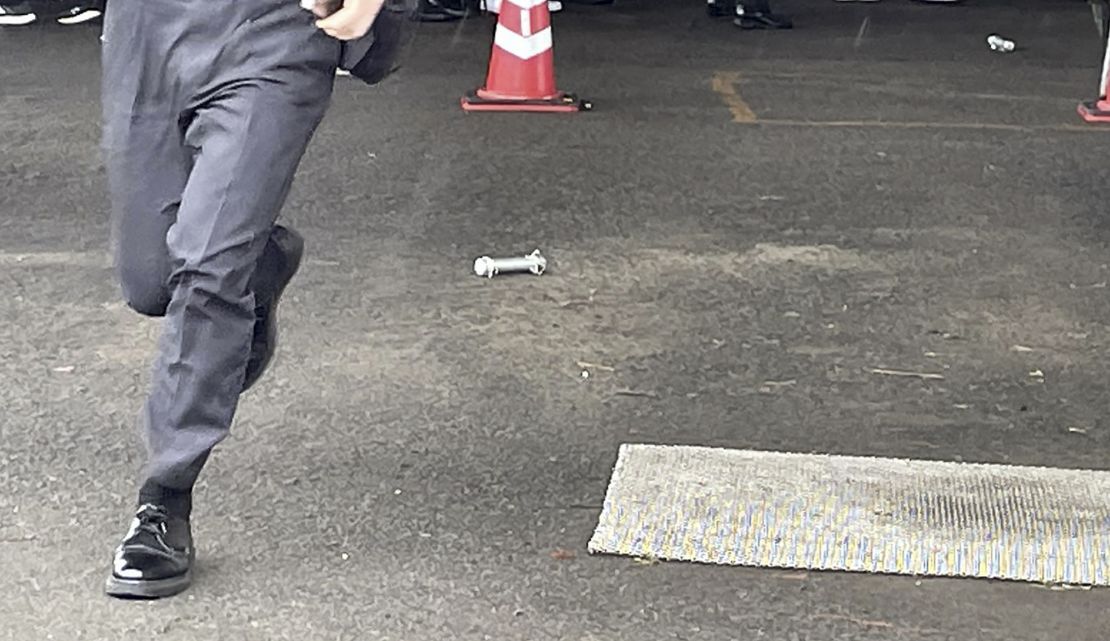 A cylinder-shaped object, believed to have been thrown while Japanese Prime Minister Fumio Kishida was giving a speech in Wakayama on April 15, 2023. 