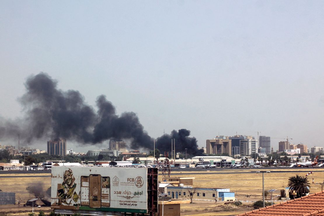 Heavy smoke bellows above buildings in the vicinity of the Khartoum's airport on April 15, 2023, amid clashes in the Sudanese capital.