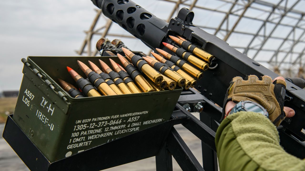 A member of Ukraine's mobile air defense group, or so-called drone hunters, checks a  Browning machine gun on top of a pick up truck at the Hostomel airfield near Kyiv, Ukraine, on April 1, 2023.