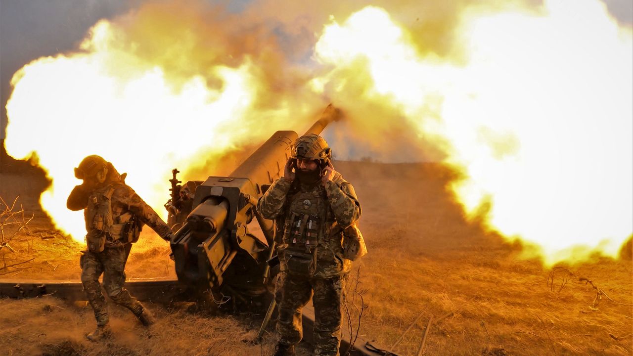 Ukrainian servicemen fire a D-30 howitzer at Russian positions near Bakhmut, eastern Ukraine, on March 21, 2023.