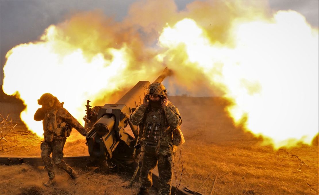 Ukrainian servicemen fire a D-30 howitzer at Russian positions near Bakhmut, eastern Ukraine, on March 21, 2023.