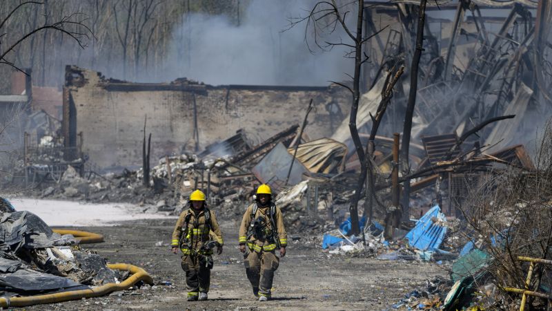 Indiana’s recycling plant fire is mostly out, but evacuations remain as crews monitor air quality and clear debris from schools and homes