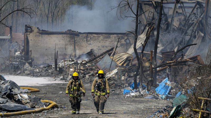 Indiana’s recycling plant fire is mostly out, but evacuations remain as crews monitor air quality and clear debris from schools and homes | CNN