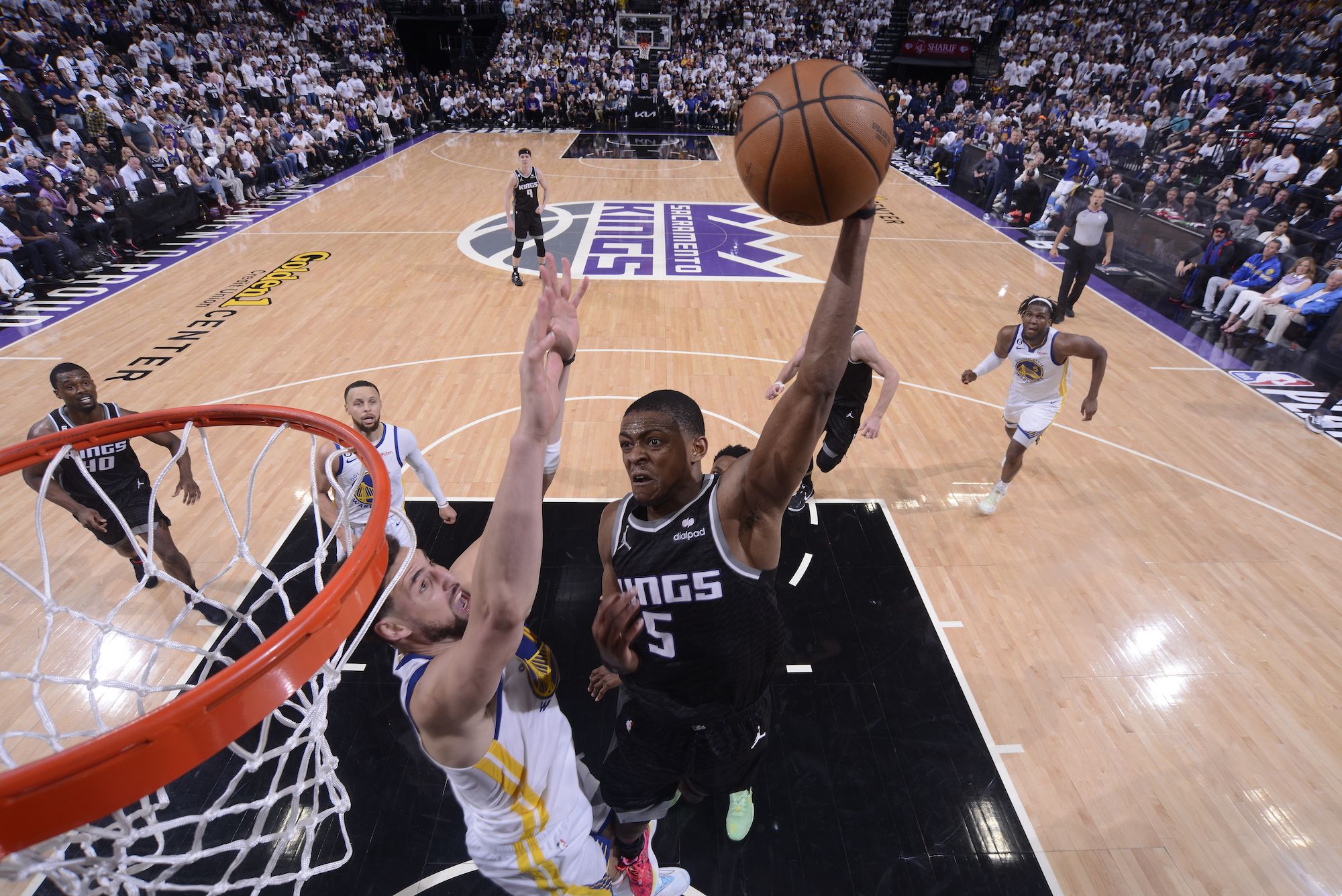 Fox leads Kings past Warriors 126-123 in playoff return