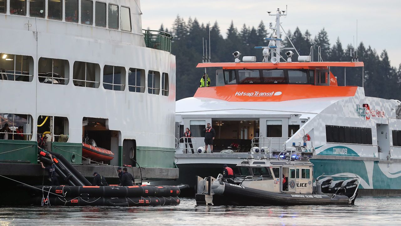 Kitsap Transit's Commander passenger ferry pulls in to the Walla Walla to help unload passengers from the stranded vessel.