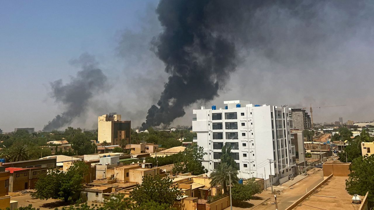 Smoke rises above residential buildings in Khartoum on April 16, 2023, as fighting in Sudan rages on for a second day.