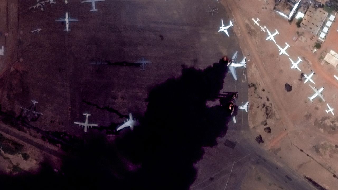 This satellite image provided by Maxar Technologies shows two burning planes at Khartoum International Airport, Sudan, Sunday April 16, 2023.