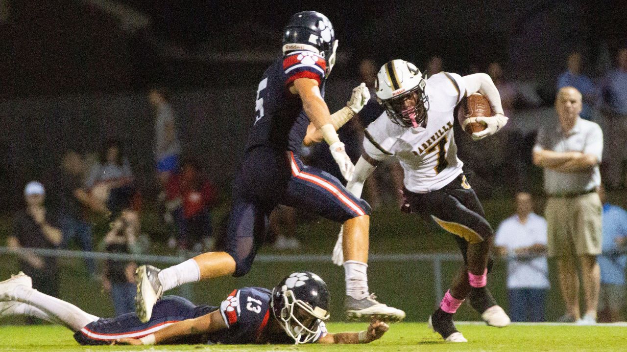 Dadeville High School's Philstavious Dowdell (7) fends off a player during a game in October 2021.