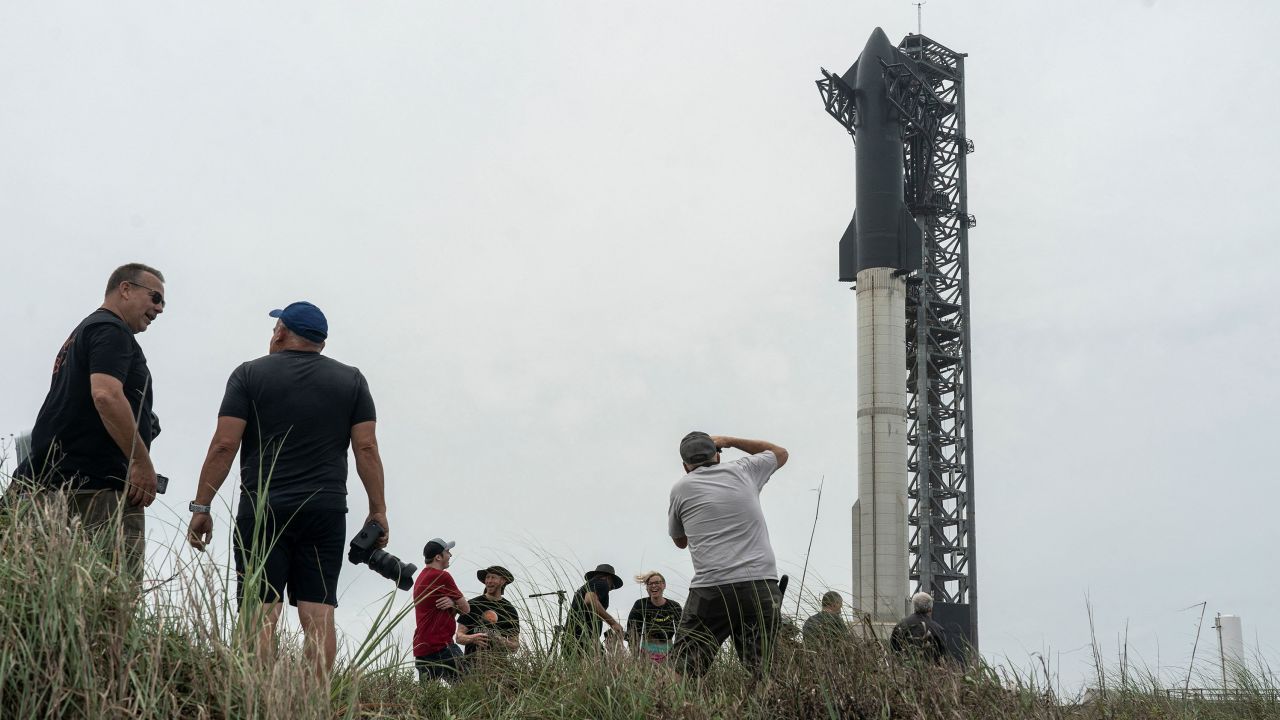 Spectators gathers to watch the SpaceX Starship on its Boca Chica launchpad after the U.S. Federal Aviation Administration granted a long-awaited license allowing Elon Musk's SpaceX to launch the rocket to orbit for the first time, near Brownsville, Texas, U.S. April 16, 2023.