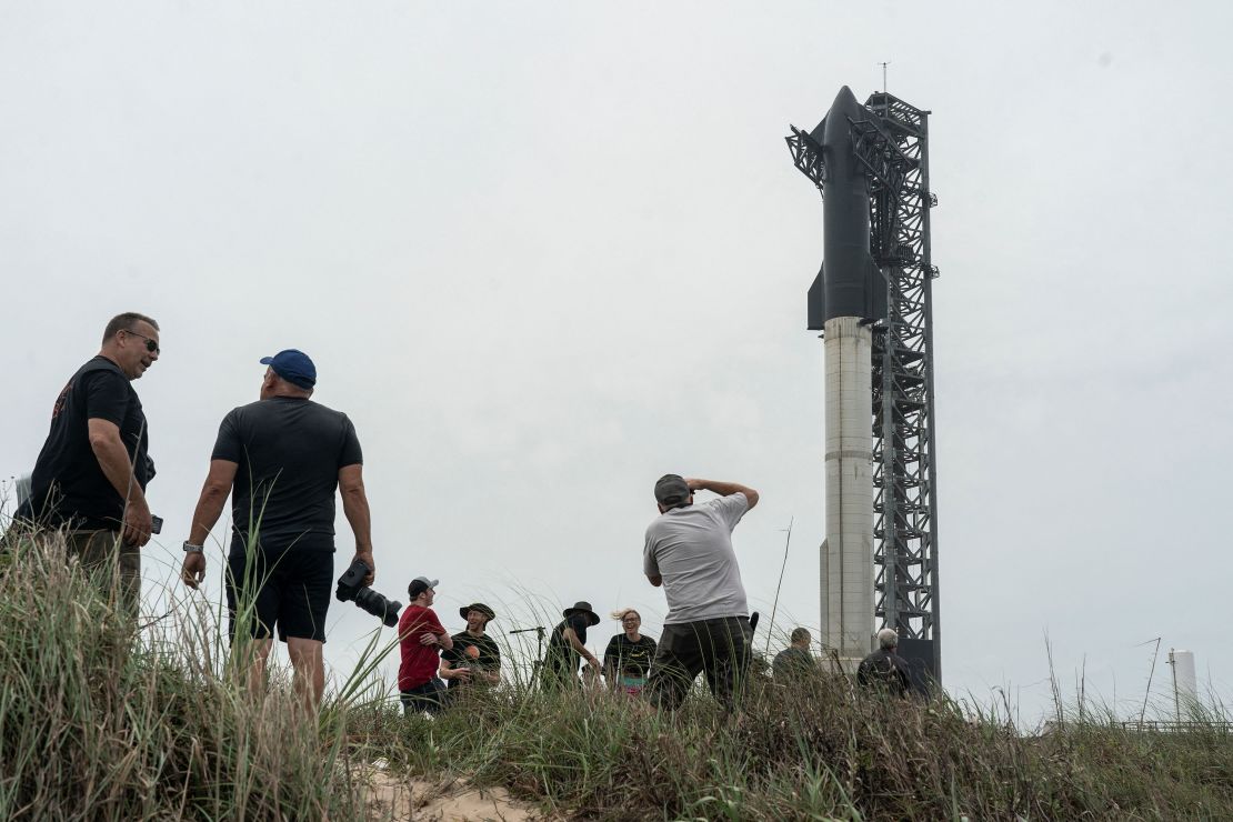 Spectators gathers to watch the SpaceX Starship on its Boca Chica launchpad after the U.S. Federal Aviation Administration granted a long-awaited license allowing Elon Musk's SpaceX to launch the rocket to orbit for the first time, near Brownsville, Texas, U.S. April 16, 2023.