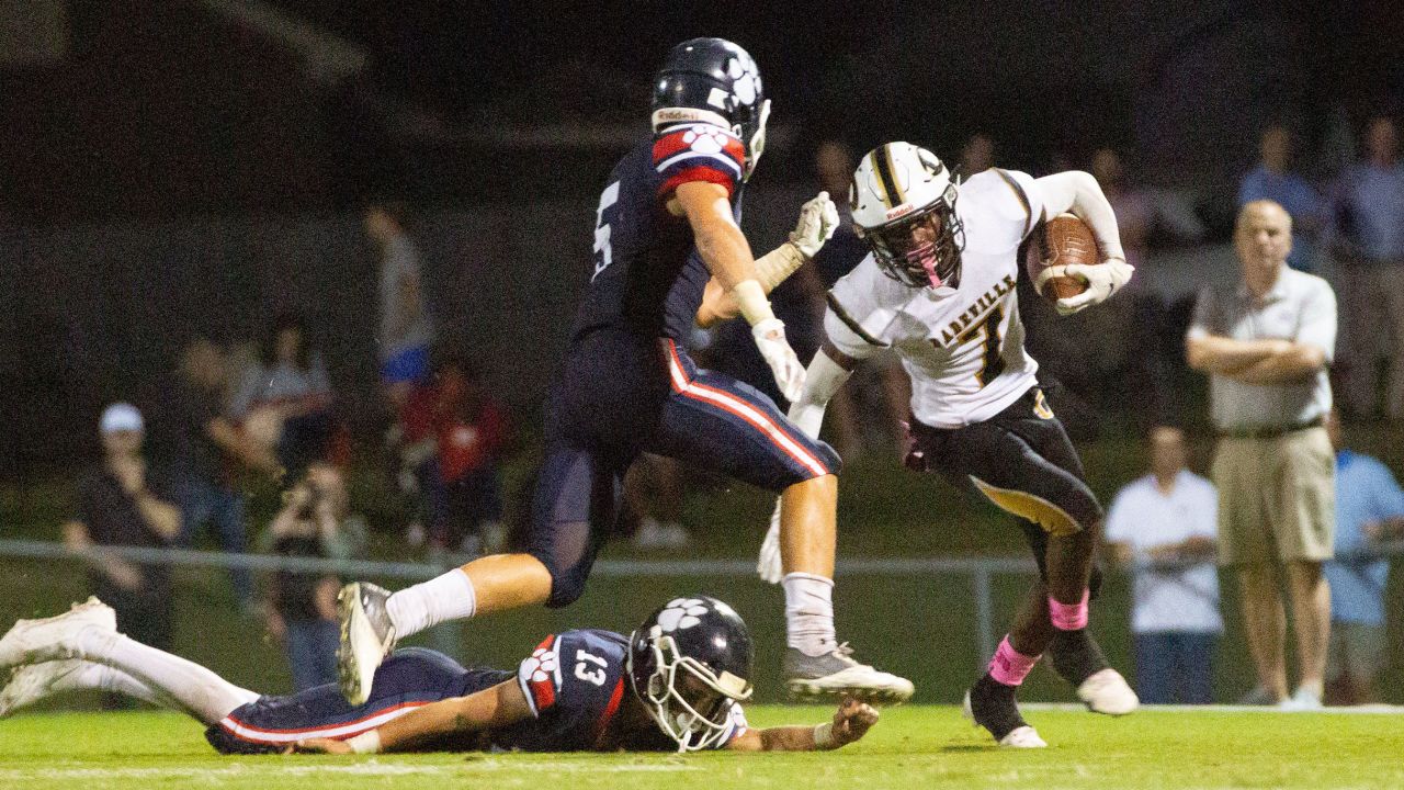 Dadeville's Philstavious Dowdell (7) fends off an opposing player during a football game on October 08, 2021.