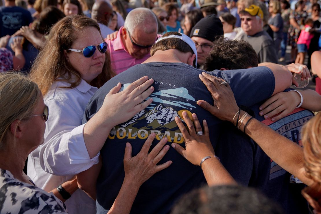 Community members grieve during a vigil the day after the shooting in Dadeville, Alabama. 