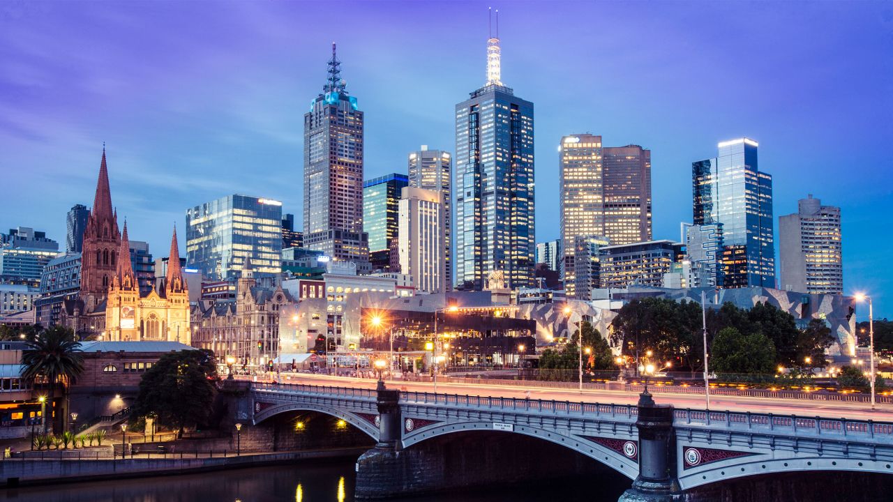 Twilight falls on the city of Melbourne in this photo, shot with a long exposure from Southbank across the Yarra River.