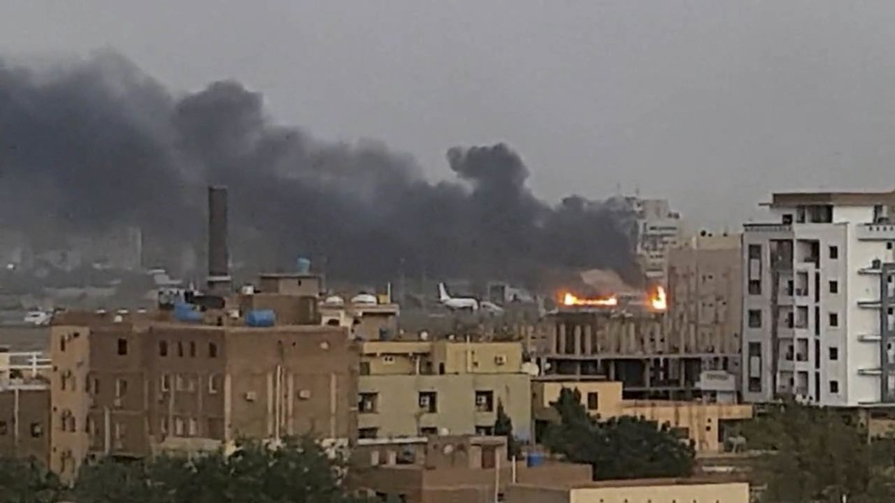 Smoke rises from the tarmac of Khartoum International Airport as a fire burns, in Khartoum, Sudan, on April 17, 2023.