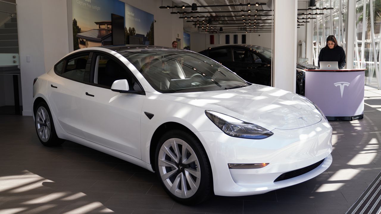 A Tesla Model 3 on display at the Tesla store in Santa Monica, California. The Model 3 is one of the cars eligible for the new EV tax credits. 