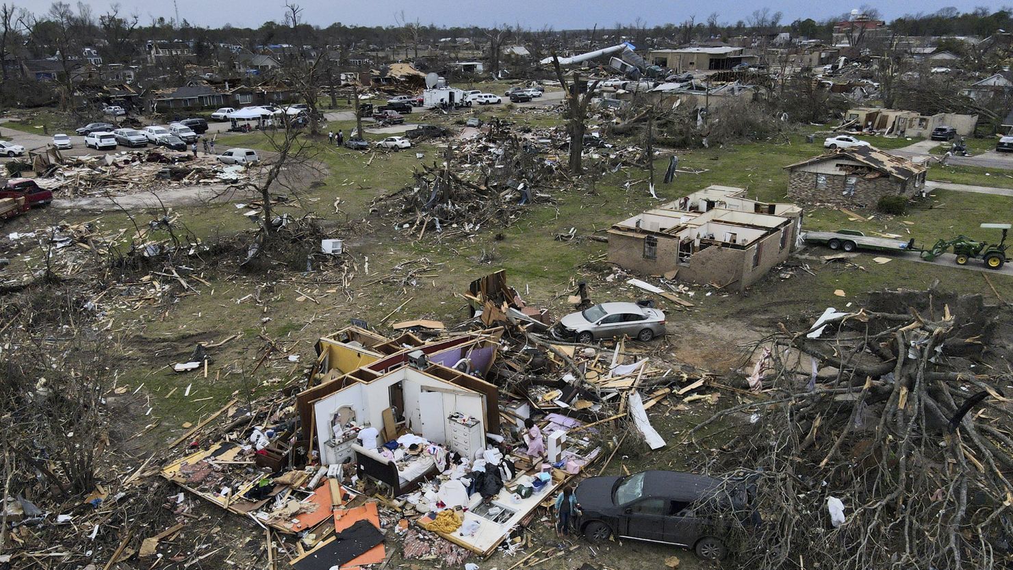 Debris is strewn about tornado damaged homes, Sunday, March 26, 2023, in Rolling Fork, Mississippi.