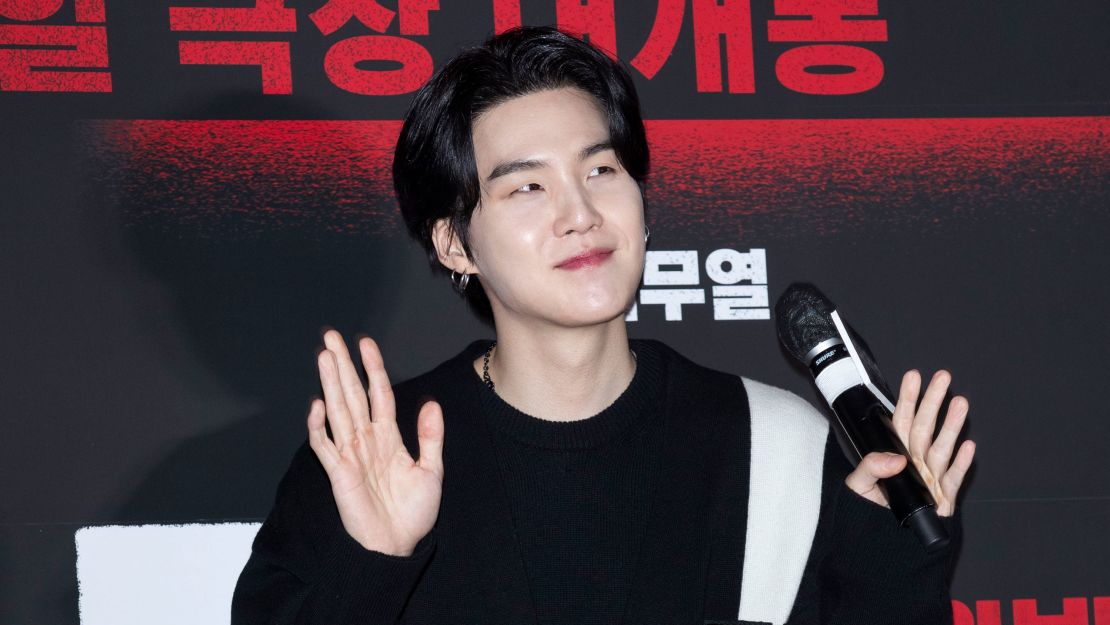  Suga, a member of boy band BTS, arrived at a photo call for the film 'The Devil's Deal' in Seoul, South Korea, on February 27. 