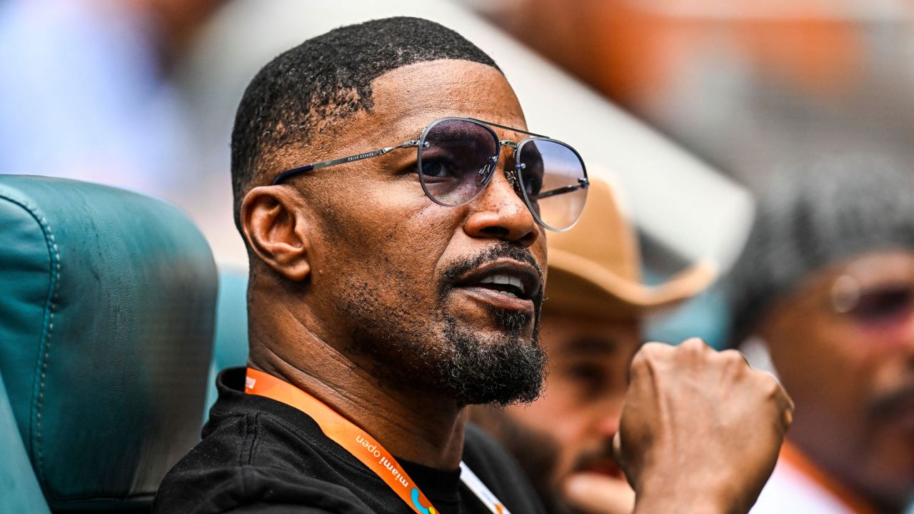 Jamie Foxx, seen here in Miami in March, remains hospitalized almost one week after experiencing a 'medical complication.'