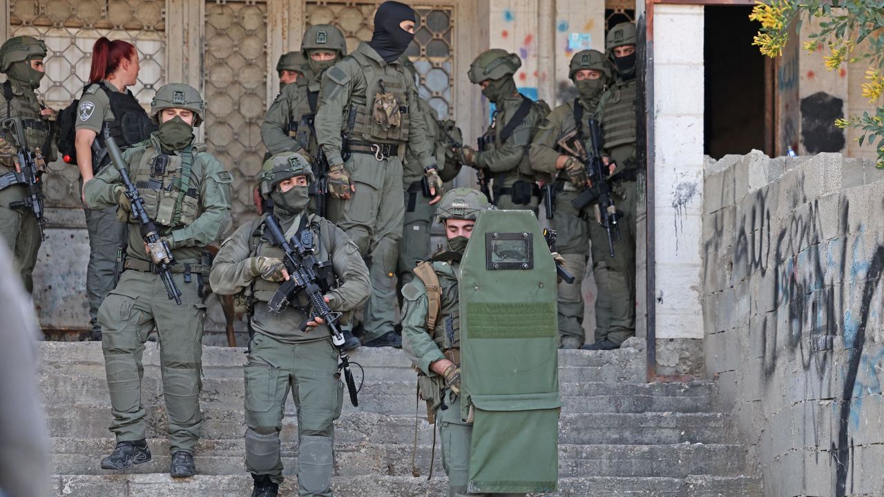 Israeli security forces search for suspects following a shooting attack in Sheikh Jarrah on Tuesday. 
