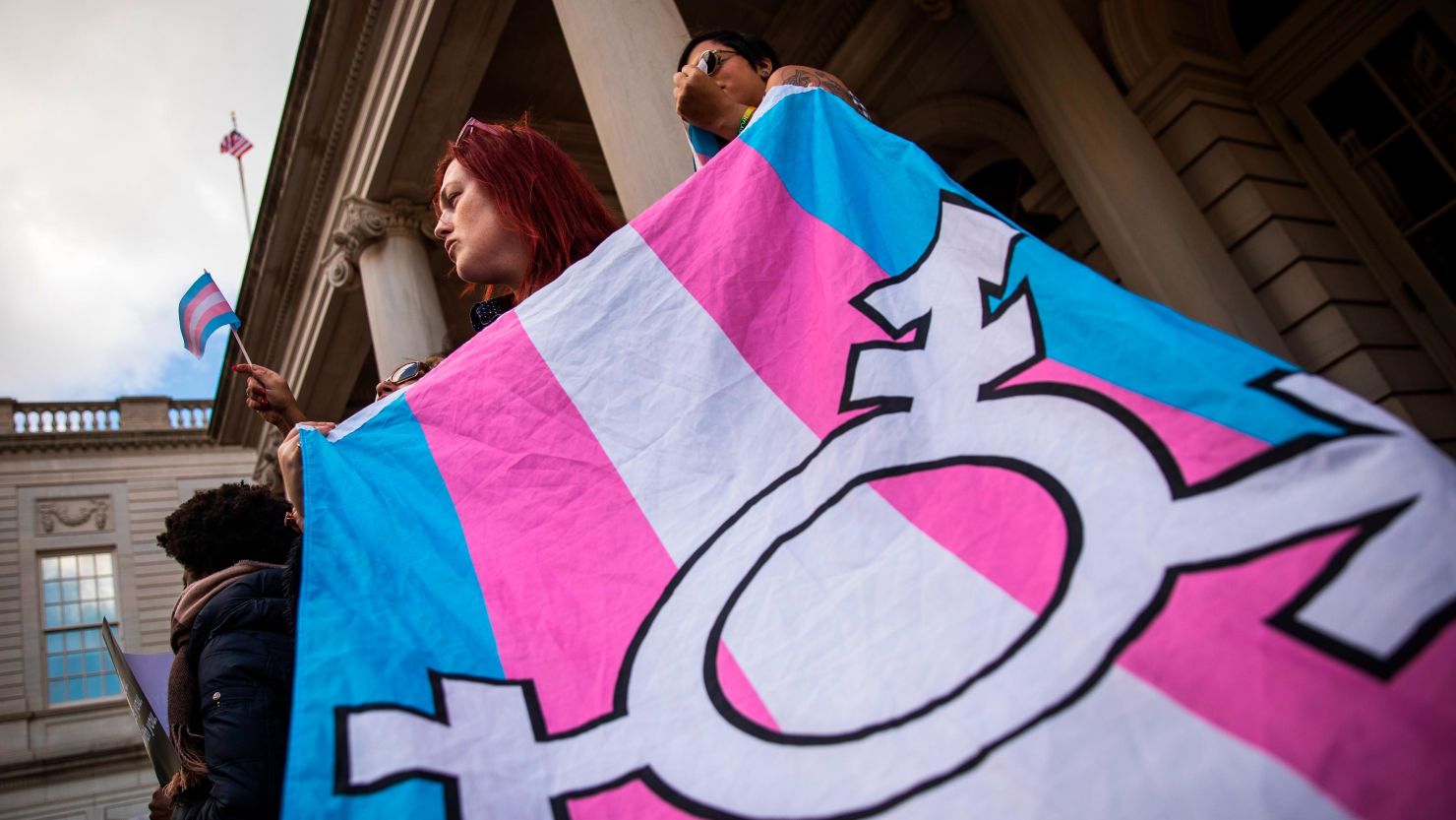 LGBTQ activists and their supporters rally in support of transgender people on the steps of New York City Hall, October 24, 2018 in New York City. The group gathered to speak out against the Trump administration's stance toward transgender people. 