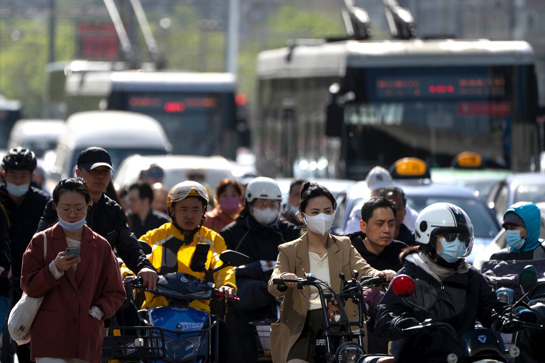 Commuters during Beijing's morning rush hour in April 2023