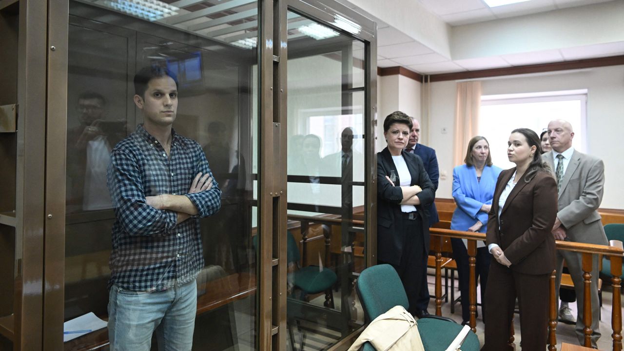 US journalist Evan Gershkovich, arrested on espionage charges, stands inside a defendants' cage before a hearing to consider an appeal on his arrest at the Moscow City Court in Moscow on April 18, 2023.