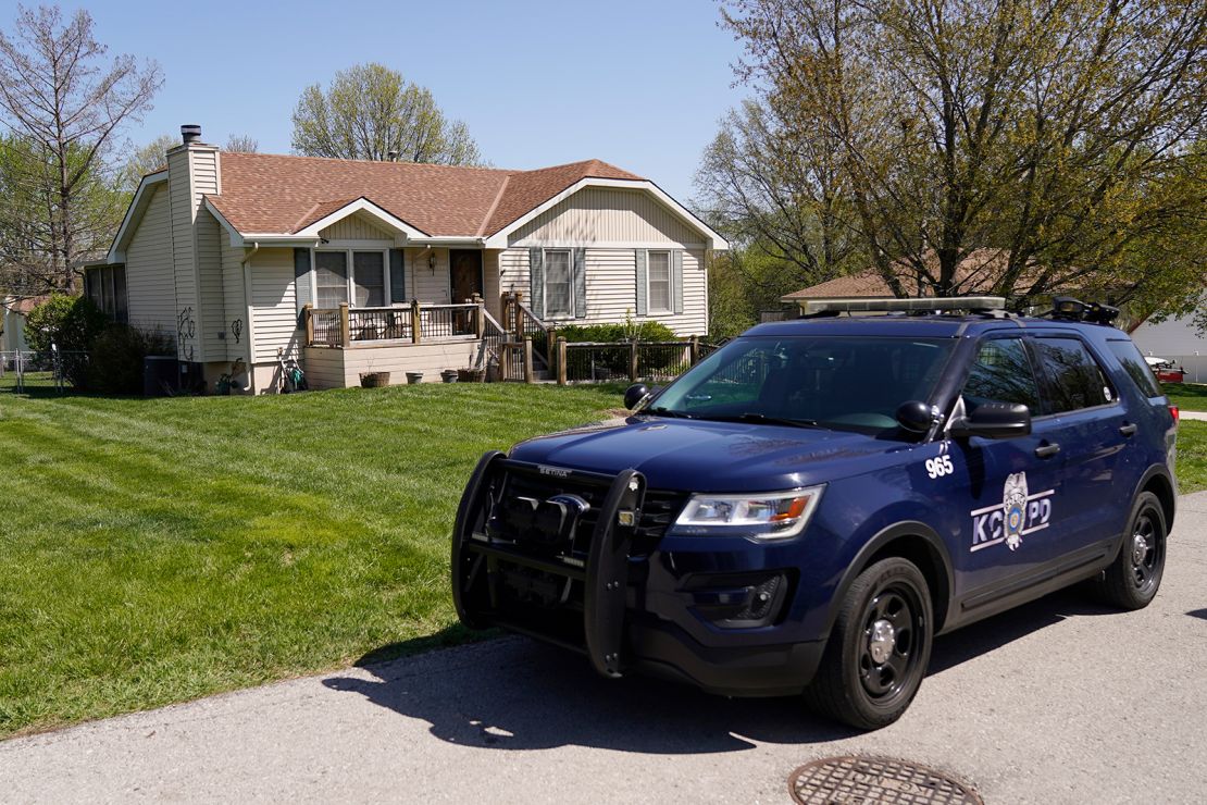 A police vehicle is seen Monday outside the house where 16-year-old Ralph Yarl was shot.