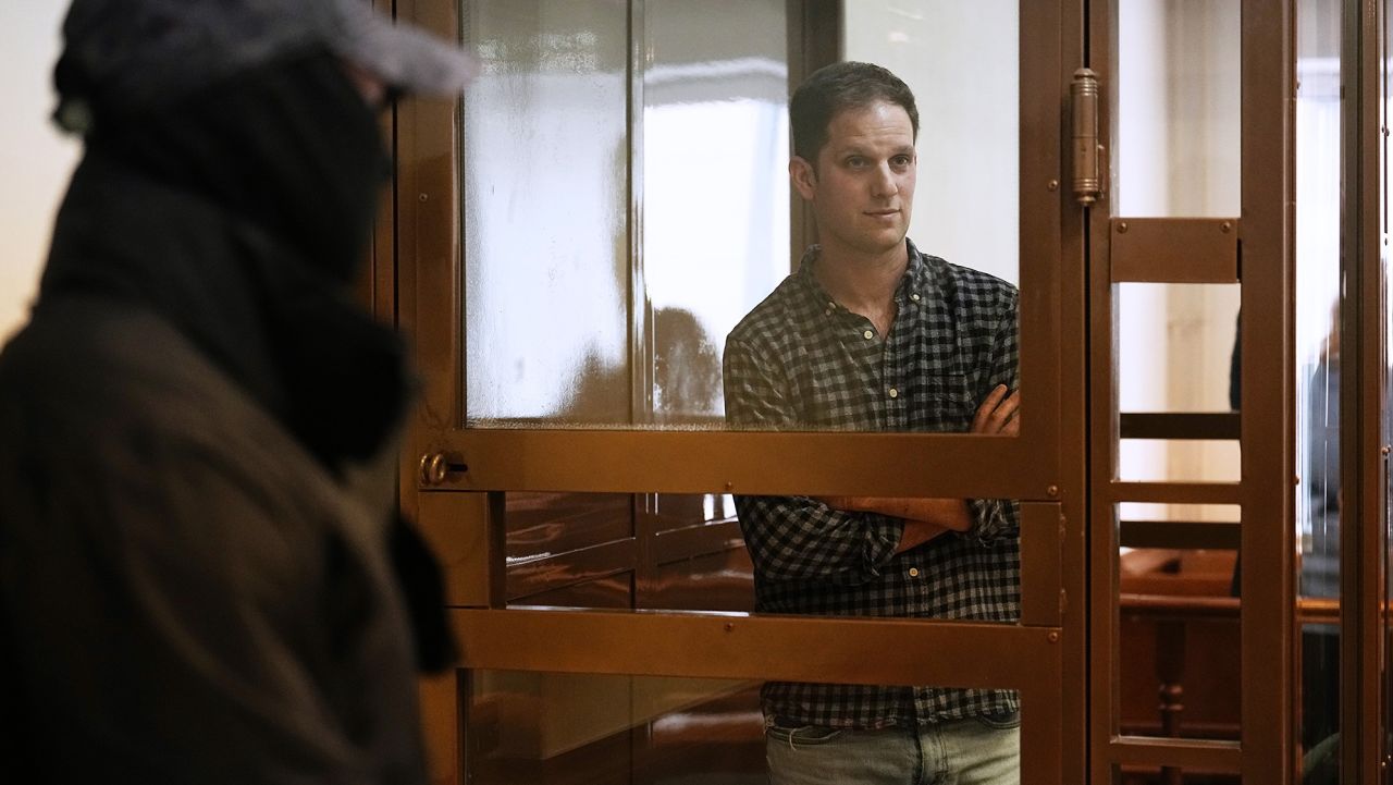 Wall Street Journal reporter Evan Gershkovich stands in a glass cage in a courtroom at the Moscow City Court, in Moscow, Russia, Tuesday, April 18, 2023. (AP Photo/Alexander Zemlianichenko)