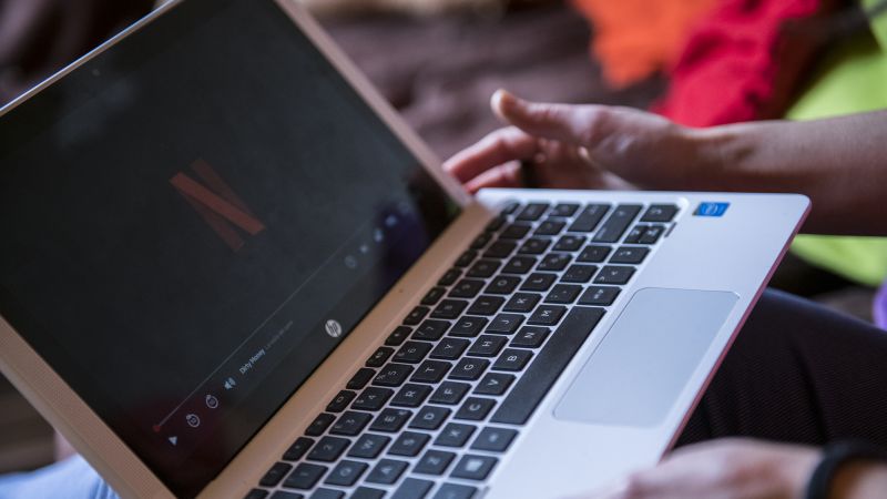 NextImg:Netflix subscriber adds disappoint after delaying password sharing crackdown | CNN Business